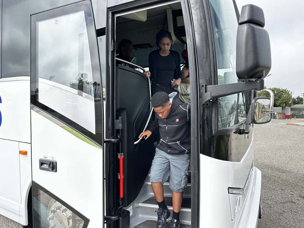 A child gets off at bus at CTF-Soledad.