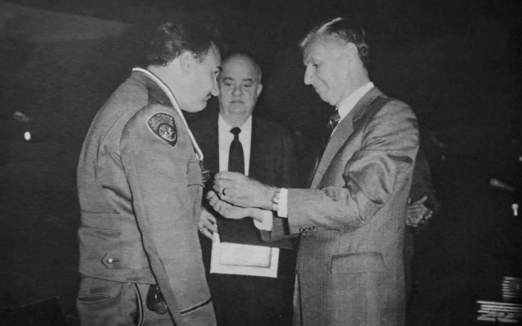 1988 ceremony Medal of Valor with governor, YACA Secretary and a lieutenant.
