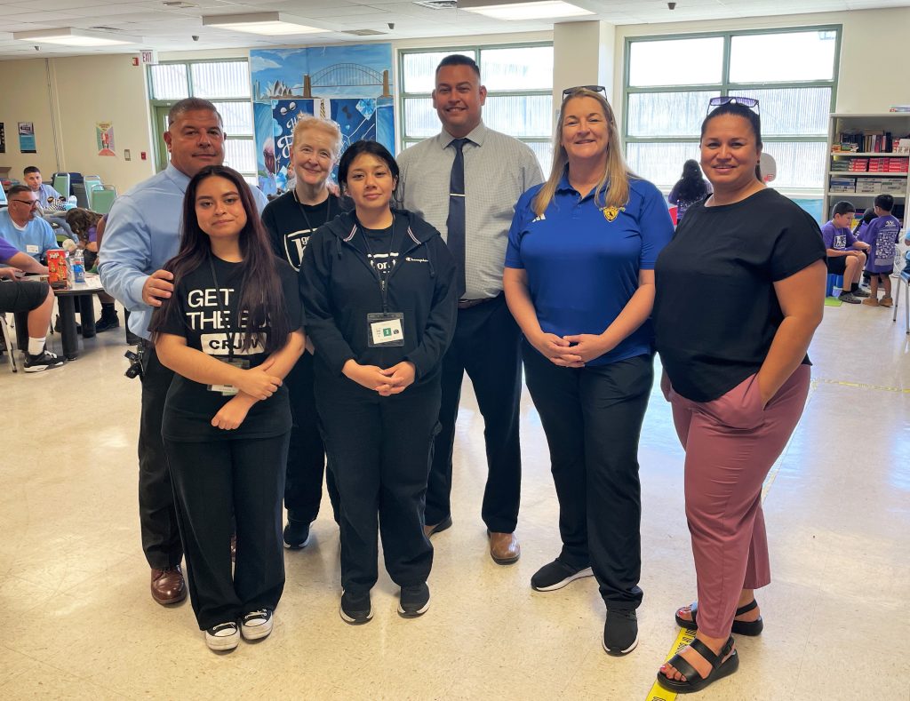 Prison staff and volunteers at SATF Corcoran during Get on the Bus visiting program.
