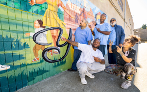 Group of mural artists at CSP-Solano with their instructor.