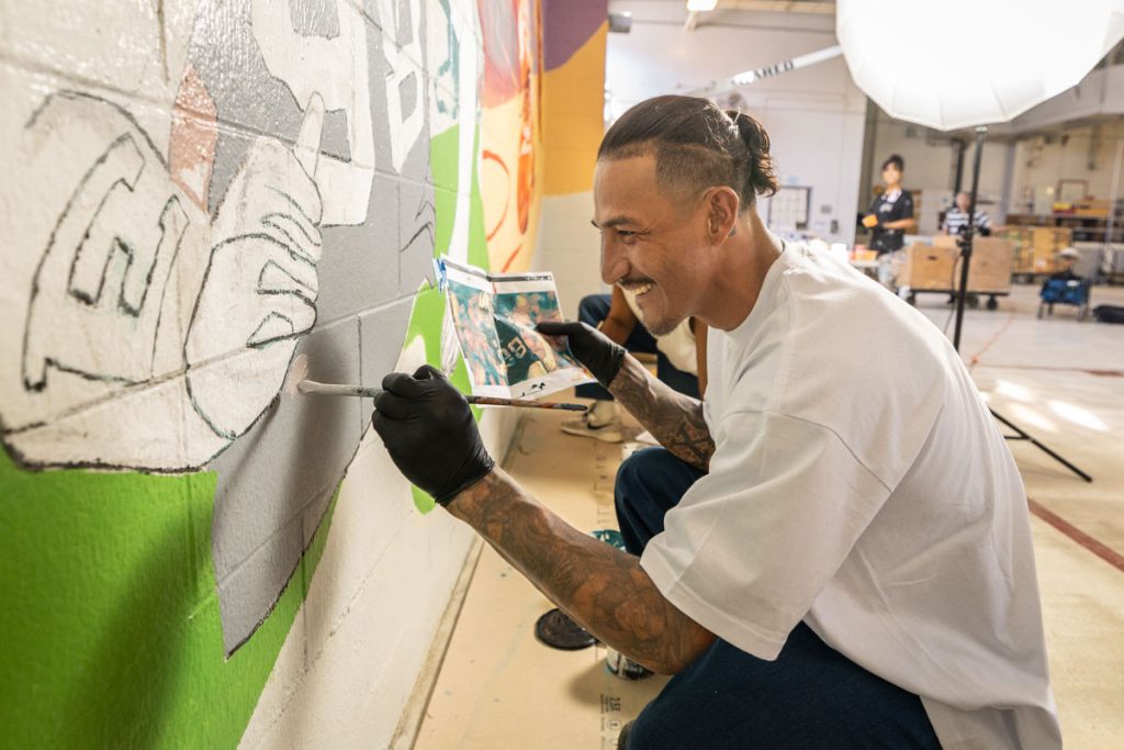 One of the mural painters at Solano.