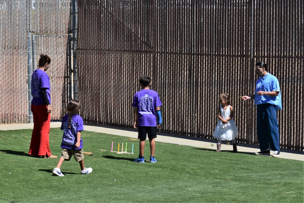 Outside games with families visiting their incarcerated loved ones through the Get on the Bus program at Salinas Valley State Prison in Soledad, Calif.
