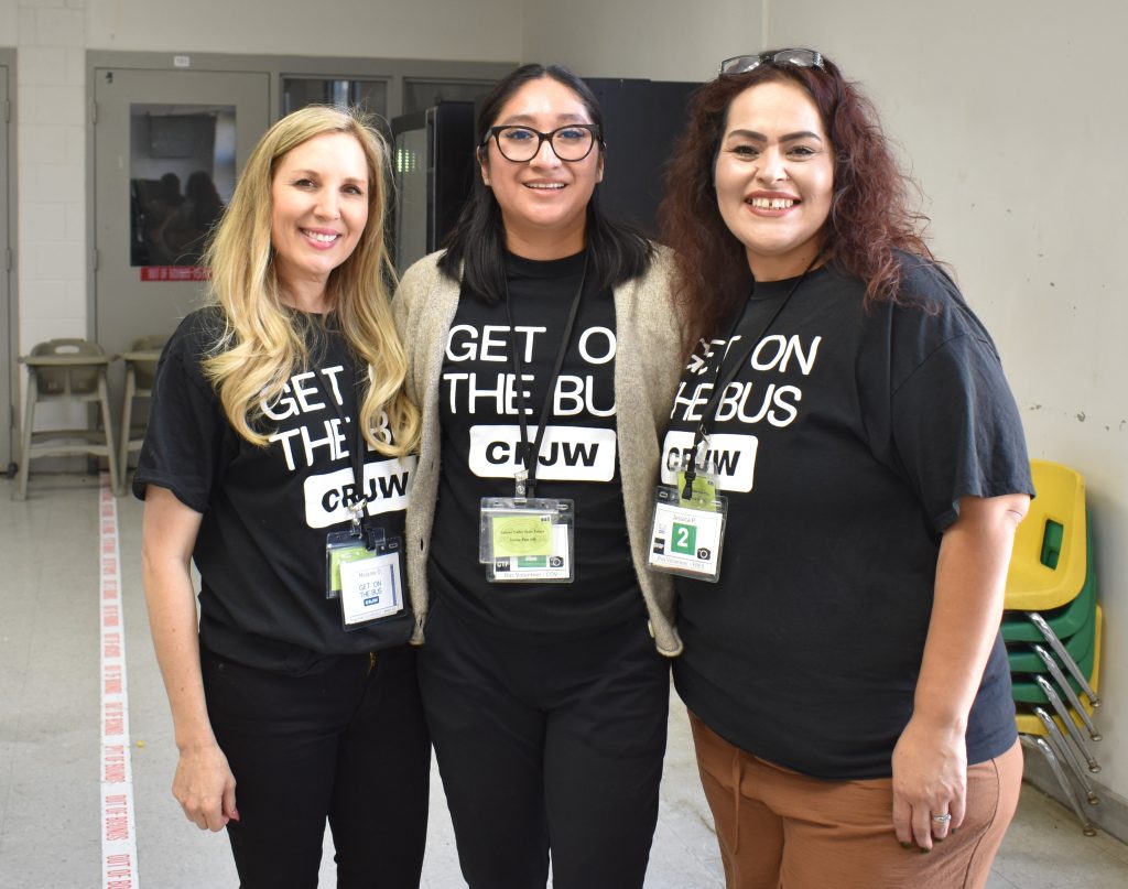 Three volunteers from Get on the Bus program.