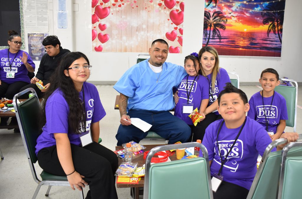 Group photo of a family visiting at Salinas Valley State Prison in Soledad, California.