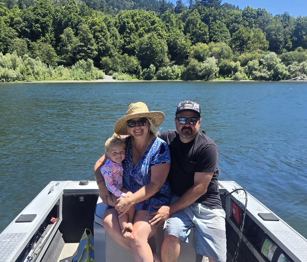 Seani Mazzetti on a boat at the lake