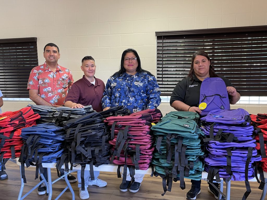 VSP staff passing out backpacks