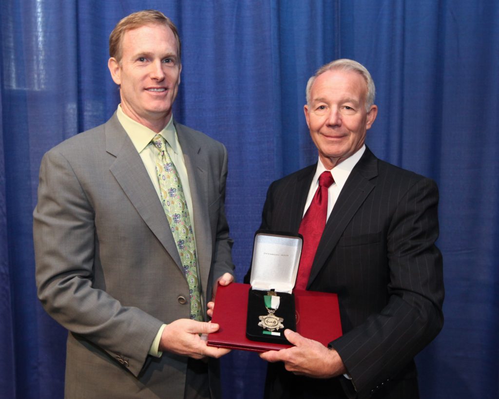 Two men and a distinguished service medal.