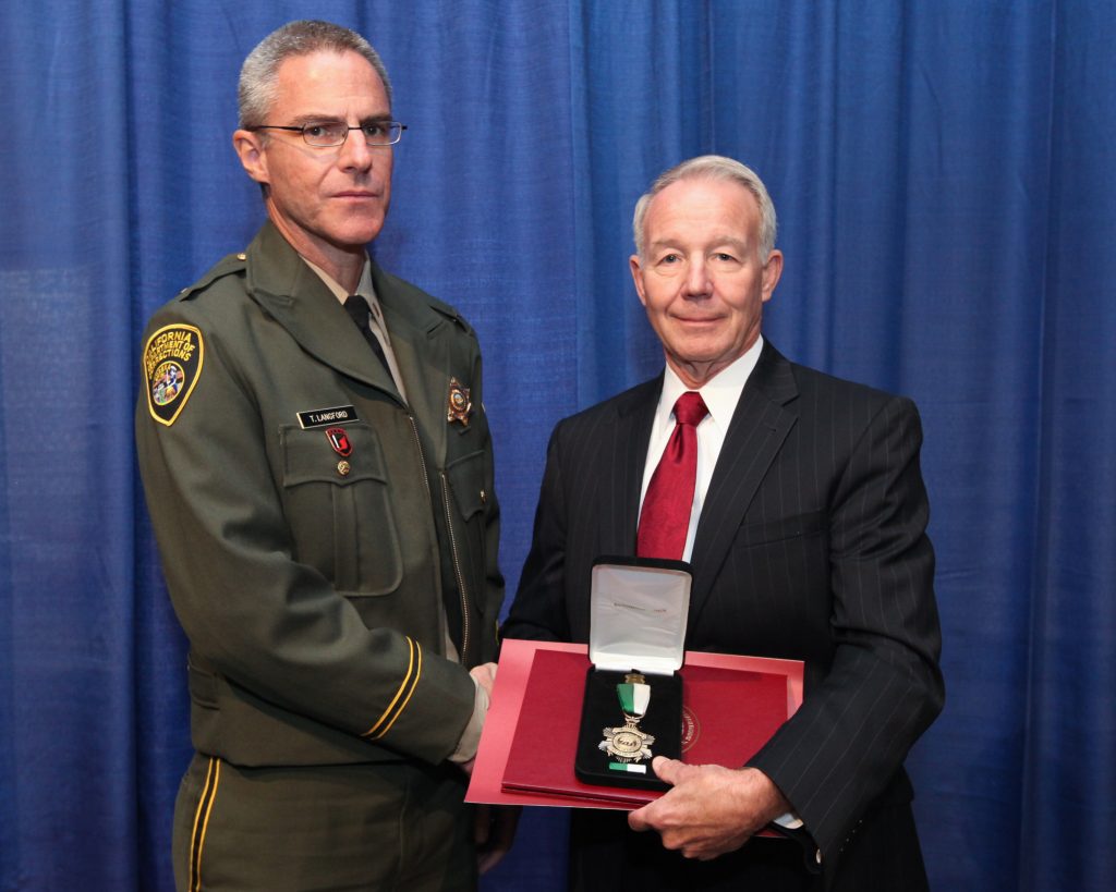 Receiving the distinguished service medal, 2013.
