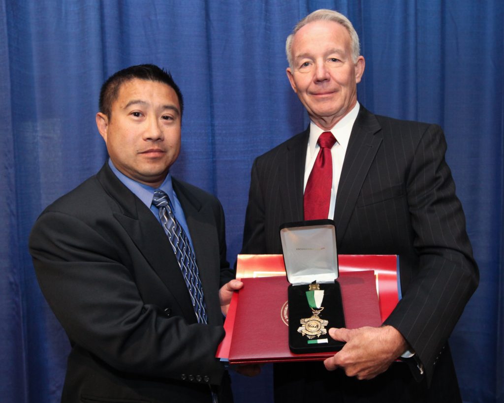 Distinguished service medal to one at the 2013 Medal of Valor ceremony.