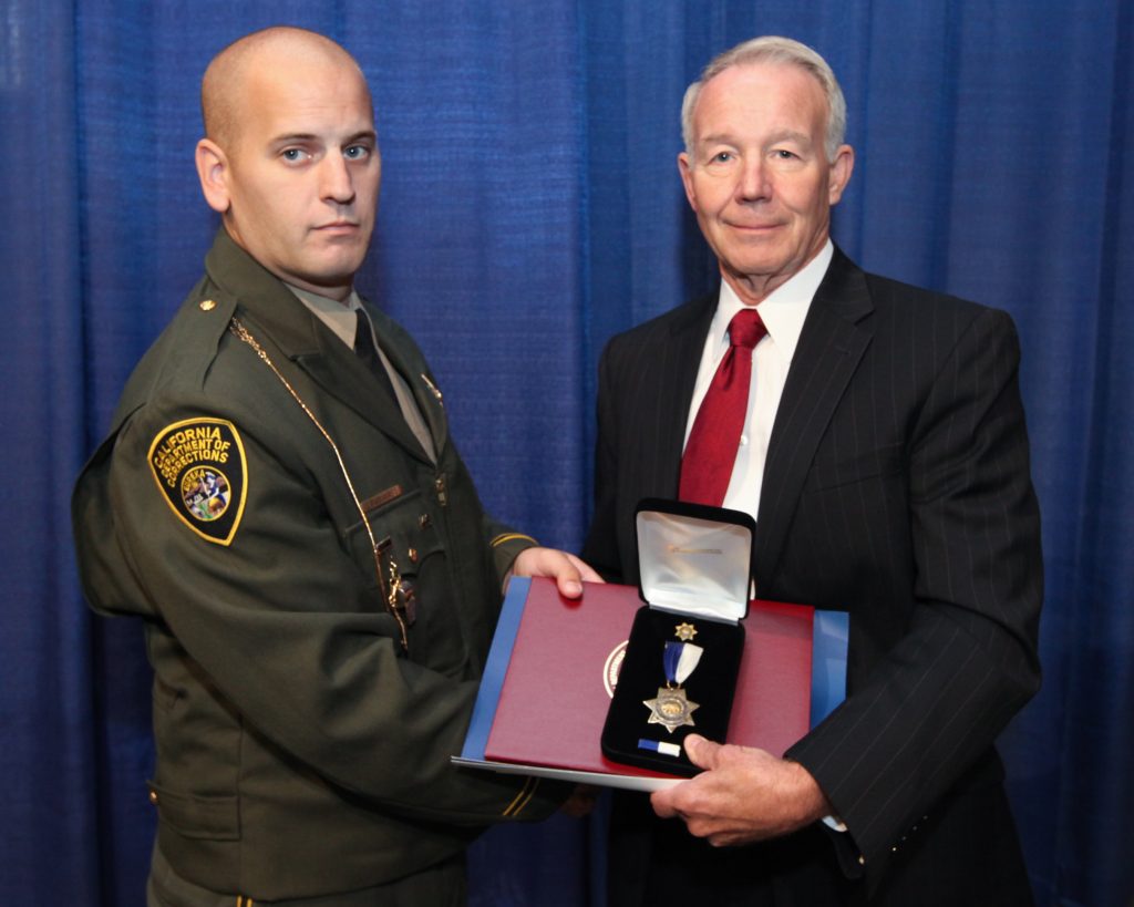 Shaking hands while receiving Gold Star.