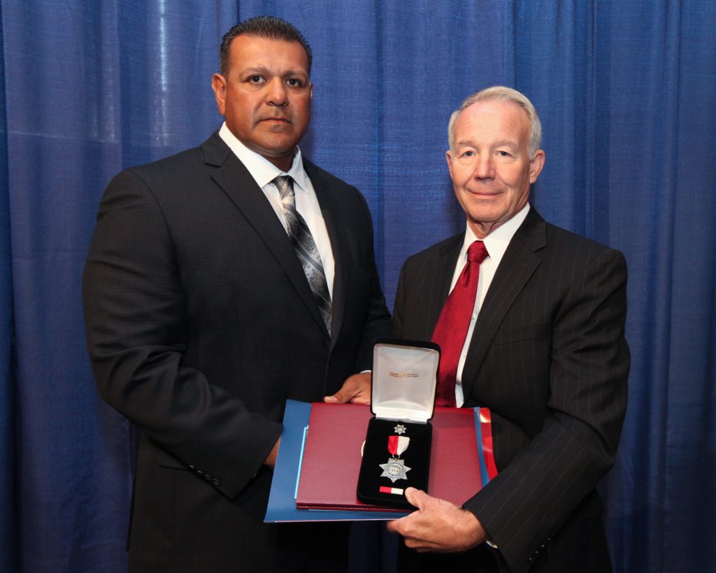 One person receives silver star medals at Medal of Valor ceremony in 2013.