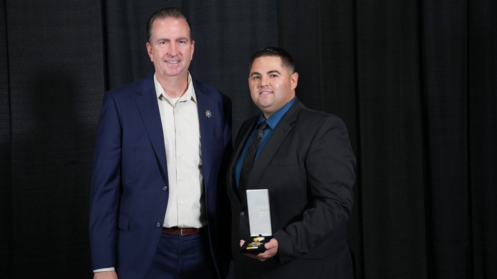 Counselor James Wilson, Bronze Star, with Secretary Macomber.