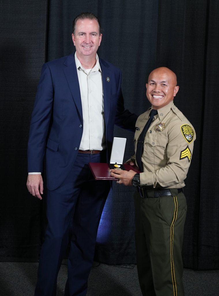Jor Lee, sergeant, 2025 Bronze Star, with Secretary Macomber.