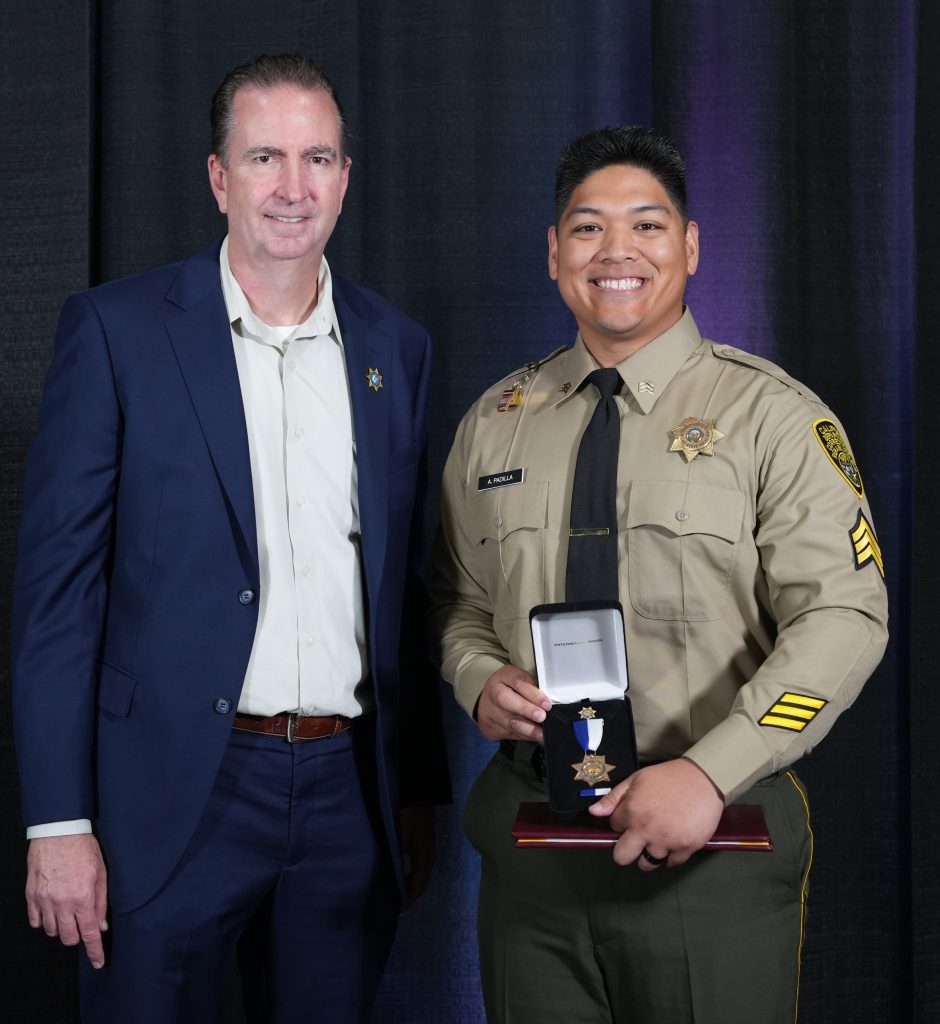 Secretary Macomber and Sgt. Alesandro Padilla, Gold Star medal.