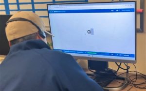 CDCR special education incarcerated student at California Men's Colony in San Luis Obispo works on a computer in the classroom.