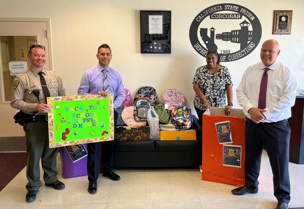 CSP-Corcoran staff with school supplies to help children return to school. 