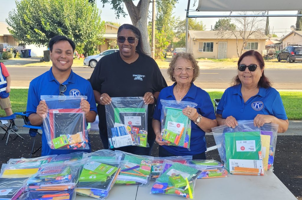 Prison staff and volunteers distribute school supplies.