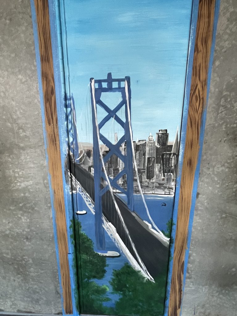Painting of a bridge on a chase door at High Desert State Prison.