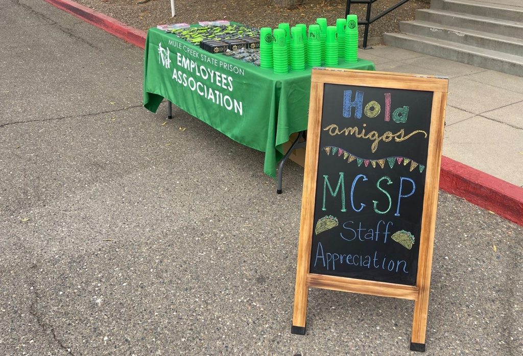 MCSP fiesta staff appreciation table with the Mule Creek State Prison Employee Association table in the background.