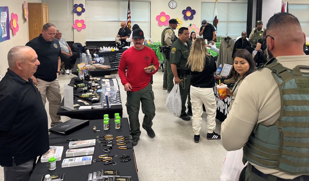 Staff check out booths at a health fair Pleasant Valley State Prison.