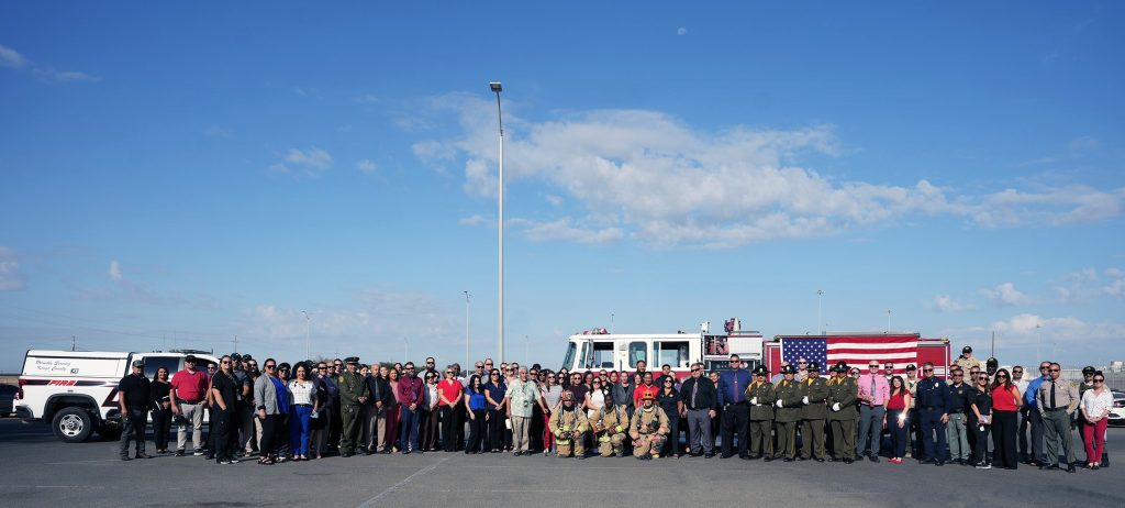 Fire engine, firefighters and staff in front of SATF for Sept. 11, 2001.