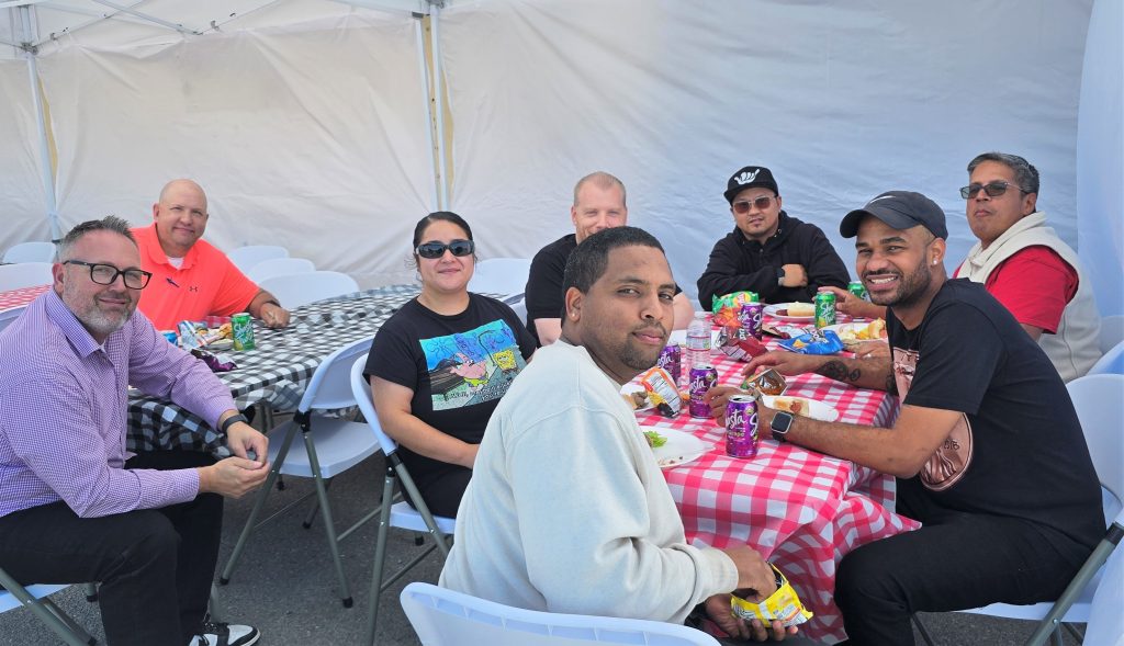 Business Services employees enjoy a barbecue during a staff-appreciation end-of-year event at San Quentin.