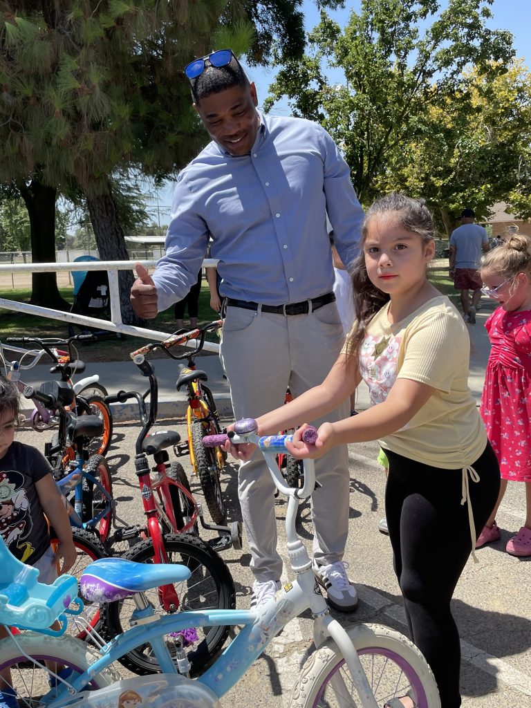 Valley state Prison acting Warden distributes bicycles.