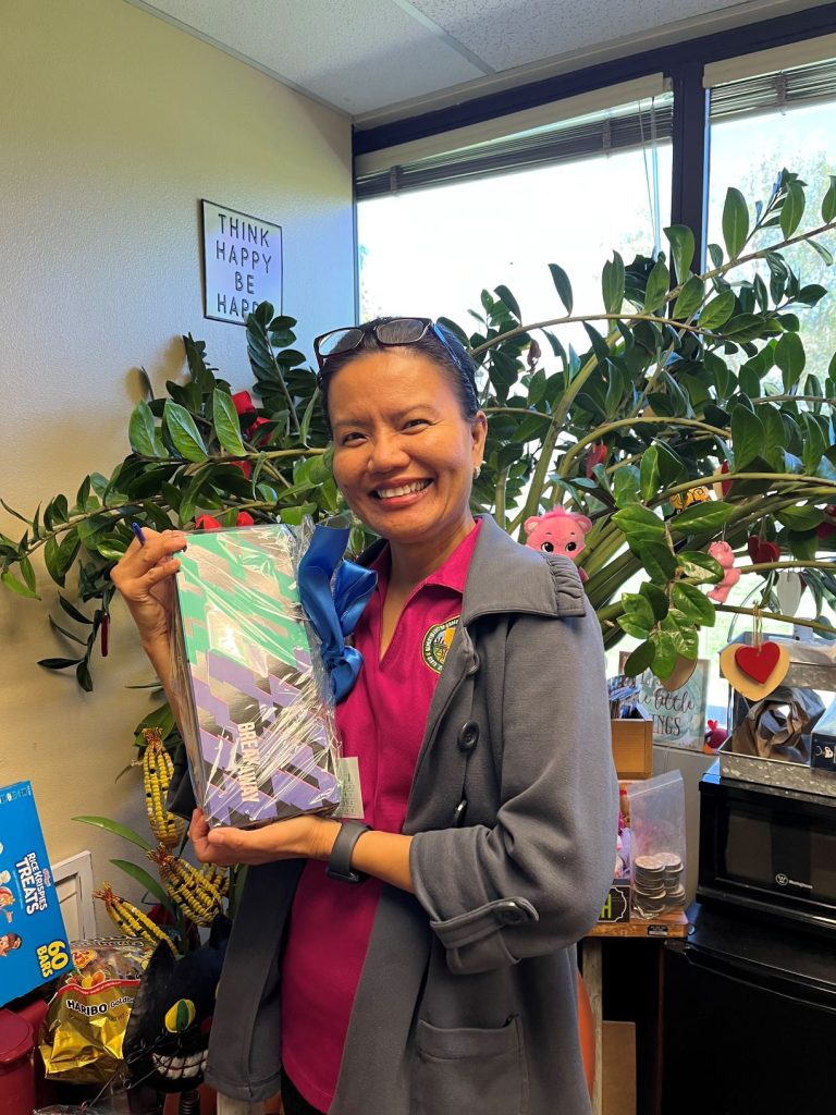 ASP employee with raffle prize