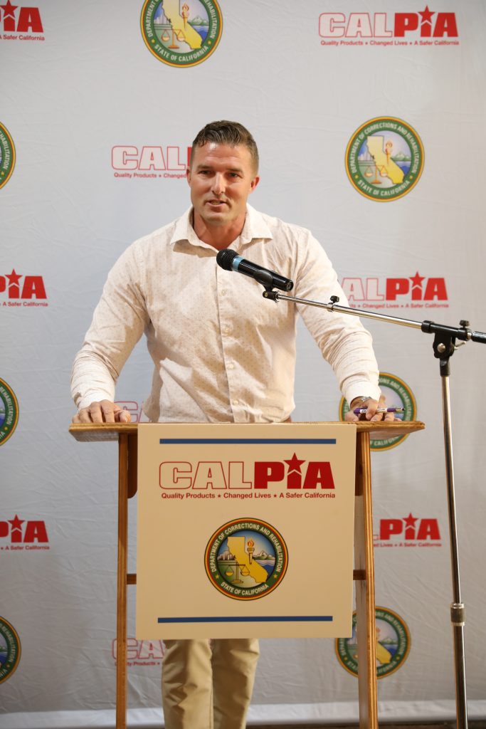 A former CALPIA graduate speaks during the graduation ceremony.