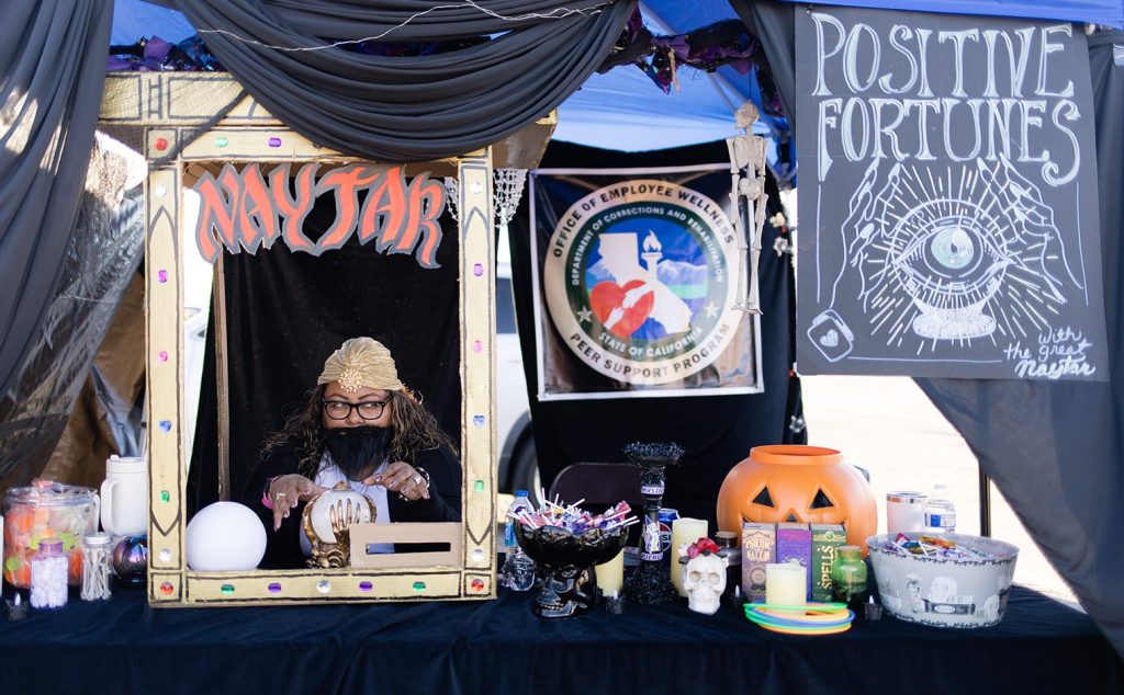 Fortune teller booth activity at Centinela State Prison Halloween staff trunk-or-treat festival.