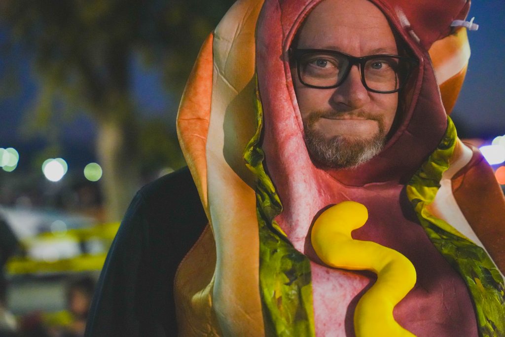 Man dressed as hotdog at a trunk-or-treat Halloween festival at CIM in Chino.