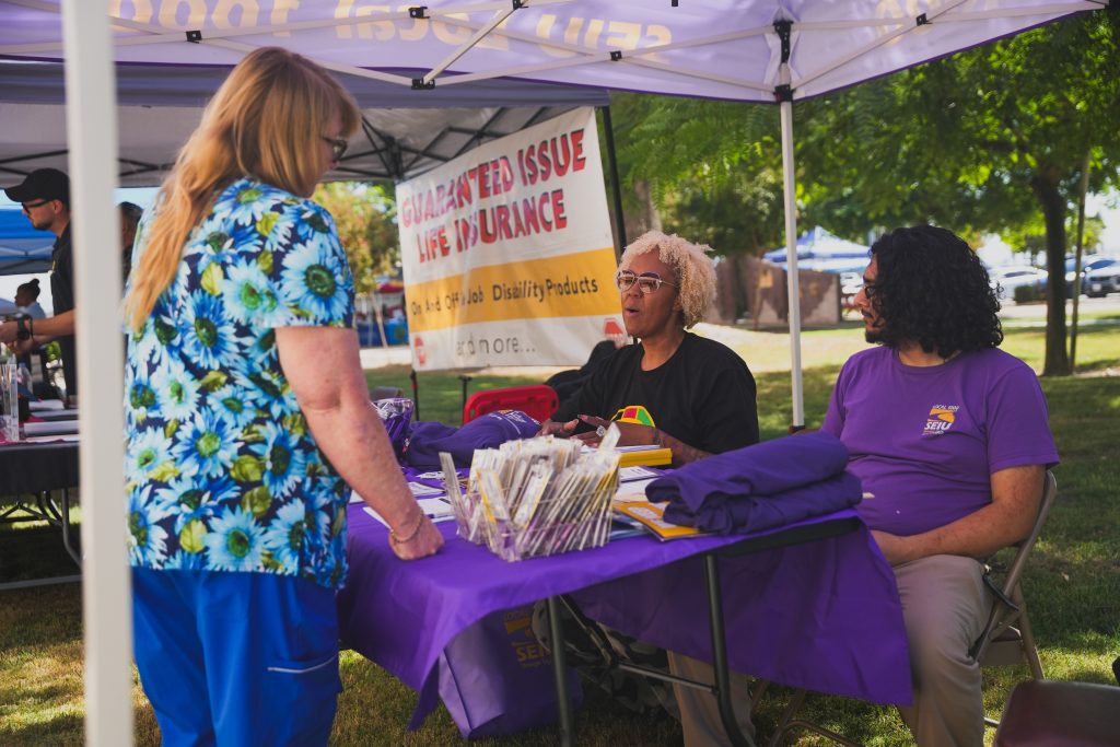 Staff talking to booth vendor