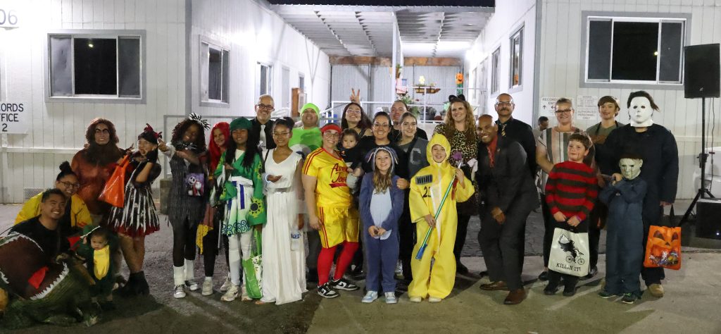 Group photo of kids in costumes at the CMF, CSP-Solano trunk-or-treat Halloween and harvest festival for staff and their families, Oct. 29, 2025, in Vacaville, Calif.