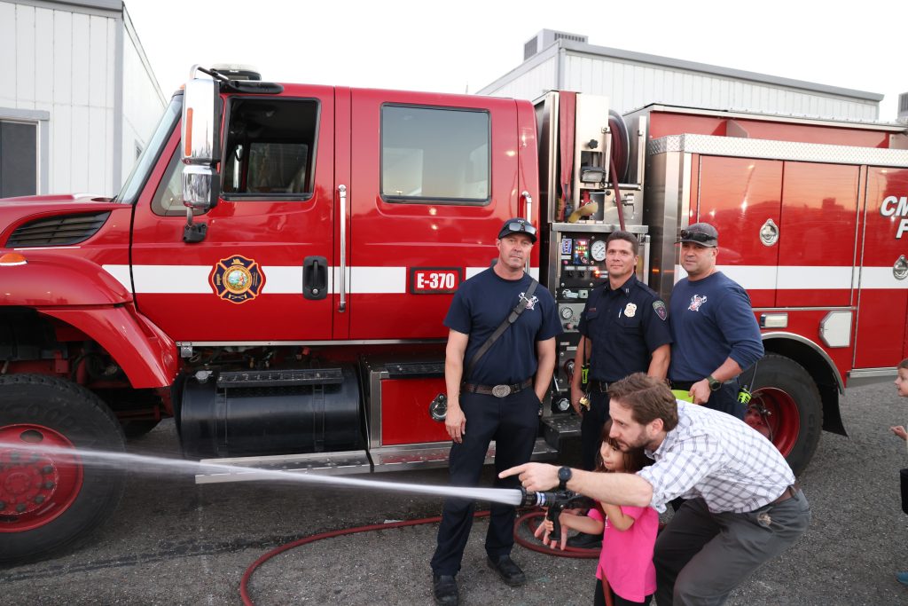 Target practice with a firehose at the CMF, CSP-Solano trunk-or-treat Halloween and harvest festival for staff and their families, Oct. 29, 2025, in Vacaville, Calif.