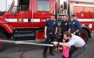 Target practice with a firehose at the CMF, CSP-Solano trunk-or-treat Halloween and harvest festival for staff and their families, Oct. 29, 2025, in Vacaville, Calif.