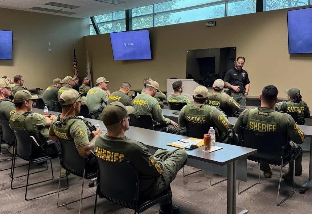 Briefing with parole agents and sheriff's deputies for a sex-offender compliance sweep.