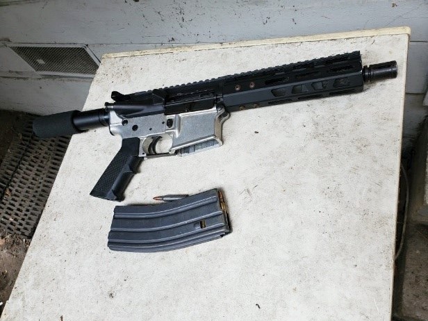 Firearm and ammunition magazine confiscated.