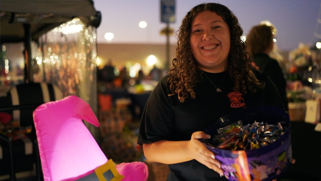 Staff passing out candy at CCWF's Family Night Halloween festival.