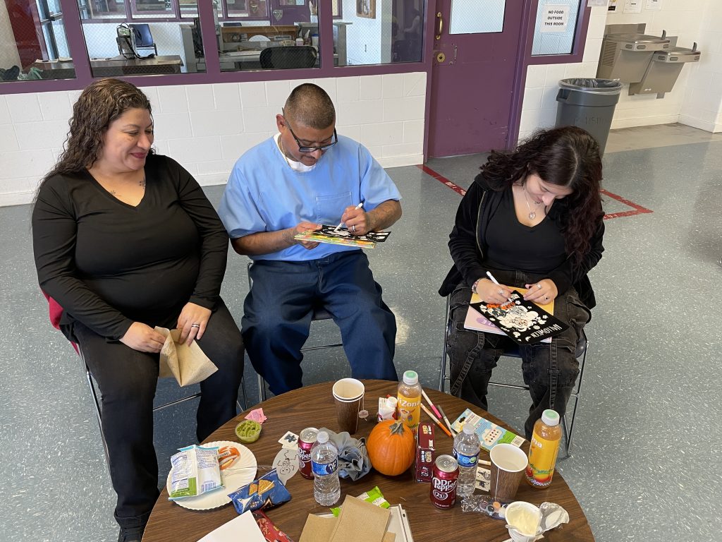 Family decorating pumpkins
