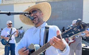 International Overdose Awareness Day at Folsom State Prison with a person performing on a guitar.