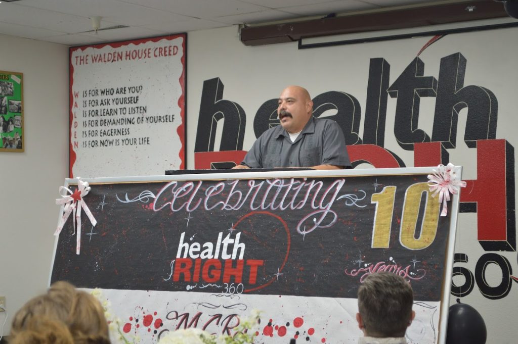 Former reentry program participant speaks during the 10-year anniversary celebration. 