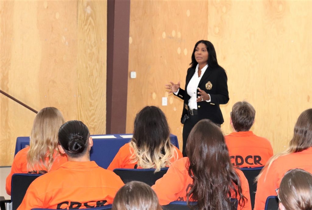 CDCR staff member speaks during Puerta La Cruz graduation.