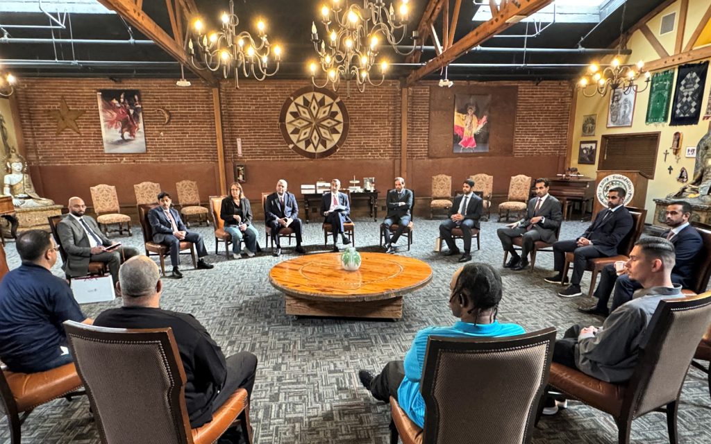 Qatar delegation seated in a circle at the MCRP-Los Angeles 2.