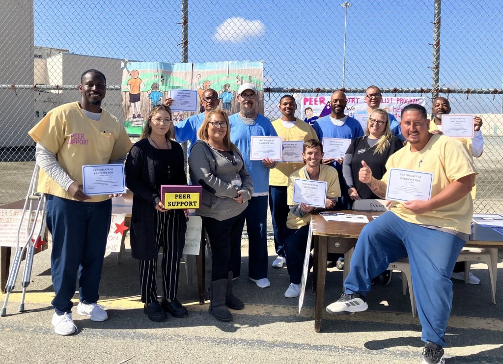 Peer support specialists receiving certificates