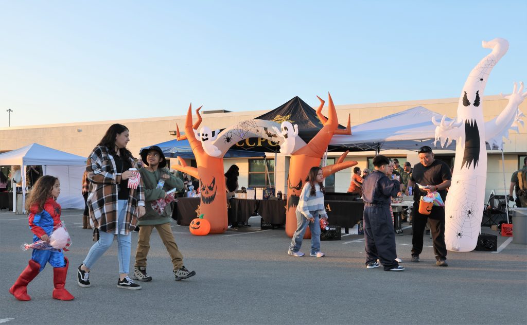 Children in costumes at SATF harvest festival for staff and their families.