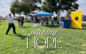SATF Warden Morales throws a ball at the dunk tank at the Operation Hope event with the words "pitching hope" overlaying the image.