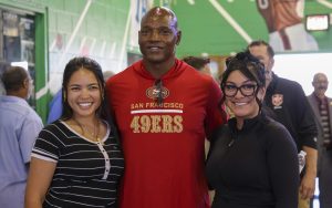 A former 49ers football player with staff members at CSP-Solano.