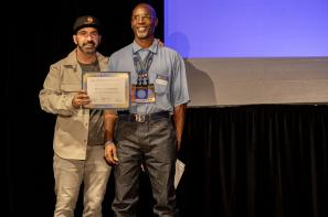 Producer Scott Budnick ("Just Mercy," "The Hangover I II and III) presents the Best Documentary Pitch Award to Kevin D. Sawyer, who is also the newly appointed Editor in Chief of the San Quentin News. Photo by Phil Bray.