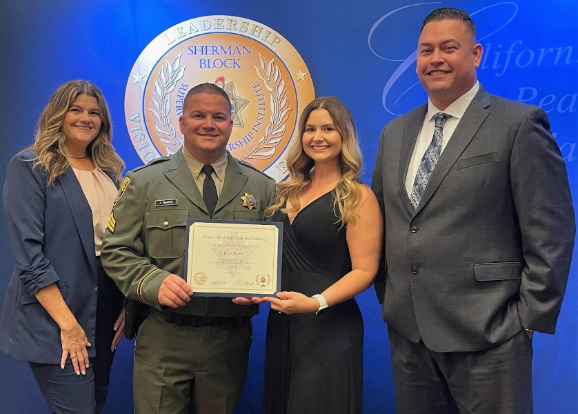 • POSED Deputy Director Gina Savala, Sgt Harris, Breanna Harris (wife), and SATF Warden Raul Morales.