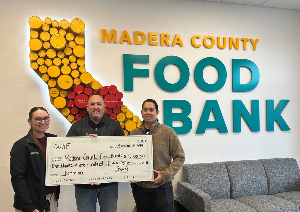 A check presentation for $1,100 to Madera County Food Bank.